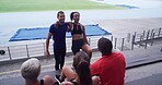 Couple of friends, athlete and happy people at stadium for sports break, talking and fitness at training. Funny, communication and runner group relax together for joke, wellness and exercise outdoor