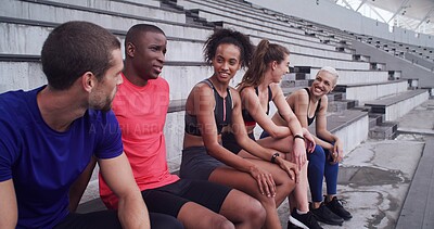 Buy stock photo Conversation, fitness and rest with friends on stadium bleachers for bonding or sports training. Break, exercise and recovery with group of athlete people speaking in venue for workout discussion