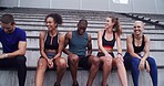 Group, people and relax on stairs at stadium for planning, fitness break and competition advice. Athlete, friends and rest for exercise discussion, training tips and race feedback of sports challenge