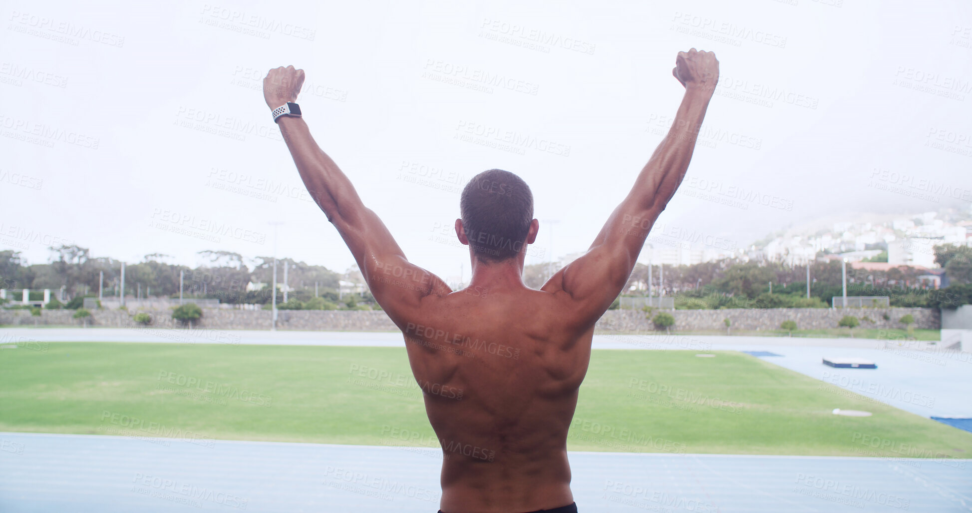Buy stock photo Man, athlete and celebration on track for goals, personal record or back for training at stadium. Person, runner and topless for fist pump, success or exercise for sports, workout or fitness in Italy