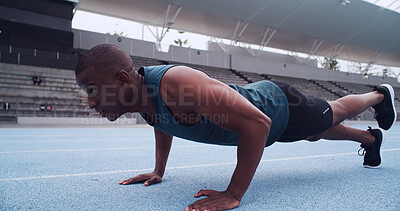 Buy stock photo Black man, athlete and push up for exercise, stadium and strong with fitness routine on track. African person, raised leg and training at sports club for muscle growth, workout or balance in Nigeria