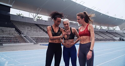 Buy stock photo Happy woman, team and smart watch on track for training with timer, stats and results for workout. People, group and athlete with stopwatch, check application and huddle with goals at sports stadium