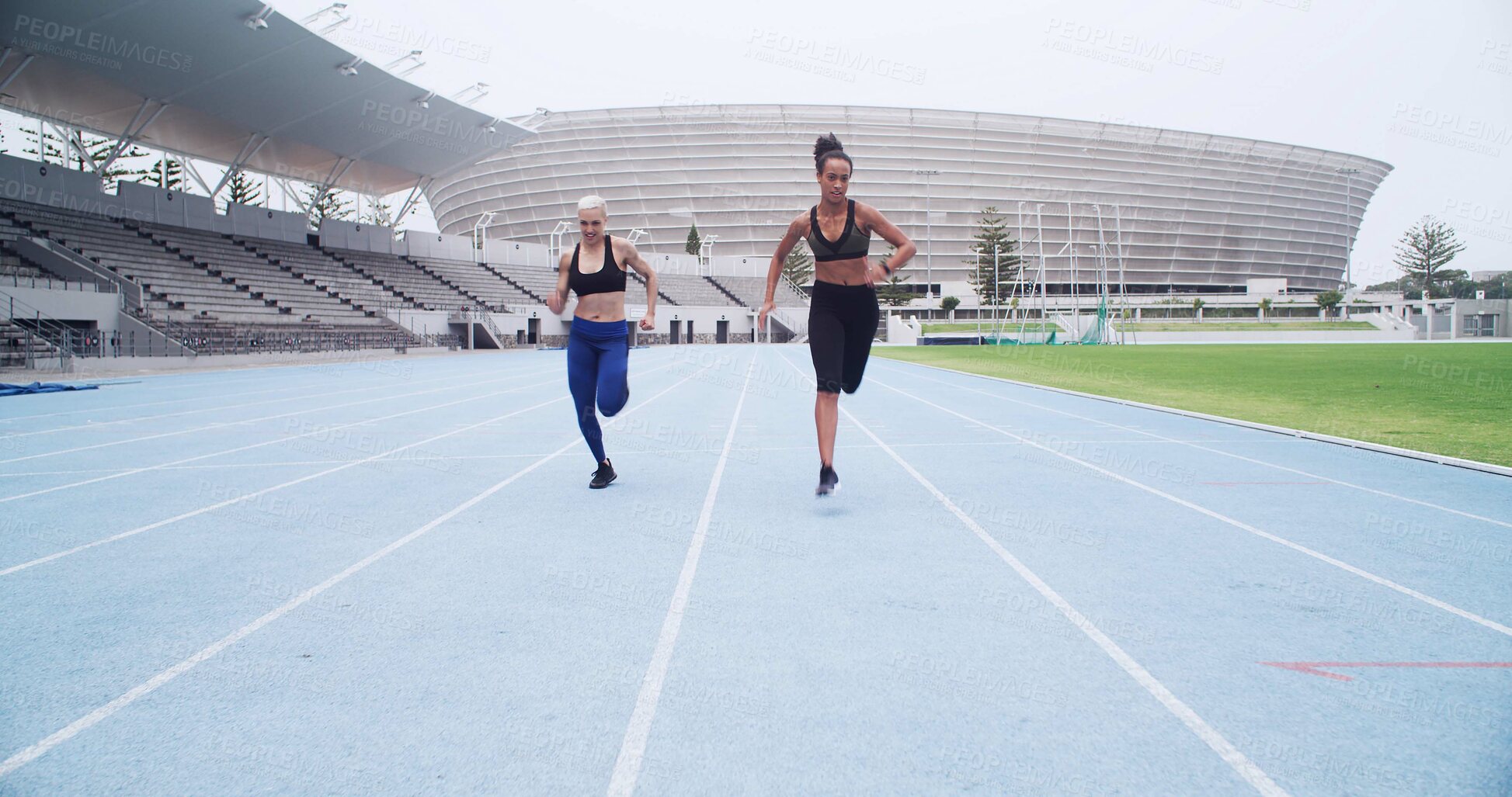 Buy stock photo Stadium, fast and women on track for running, sports challenge and cardio fitness. Speed, athlete sprinter or female runners in event for training, exercise or outdoor contest in competition arena