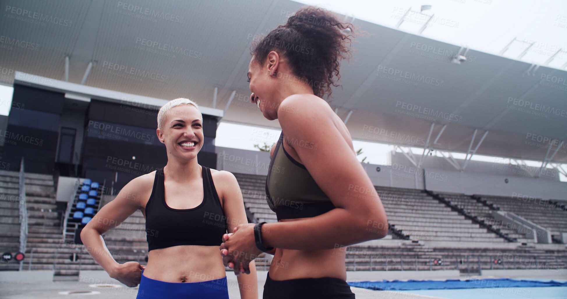 Buy stock photo Woman, athlete and talk on track at stadium with smile, listen and team with motivation for fitness. People, happy and runner at sports club with advice, training or excited at arena for competition