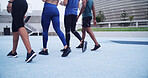 Feet, people and walk on track at stadium of fitness, start exercise and training for race. Back, runners and getting ready for endurance workout, marathon practice and sports activity of competition