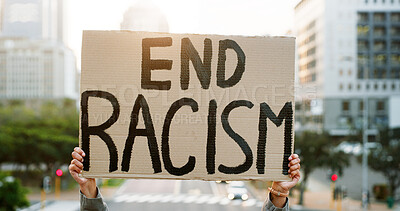 Buy stock photo Hands, racism protest and poster in city for inclusion, human rights and equality with peace in road. Person, activist and race relations rally with sign, announcement and call to action in town