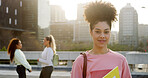 Happy woman, portrait and university student with books, pride and back to school in city. Girl, smile and outdoor at campus with confidence for learning, scholarship and college education in town