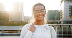 Portrait, happy woman and university student outdoor for education, learning or scholarship. Glasses, learner and girl at college campus in city with flare, development or opportunity in Brazil