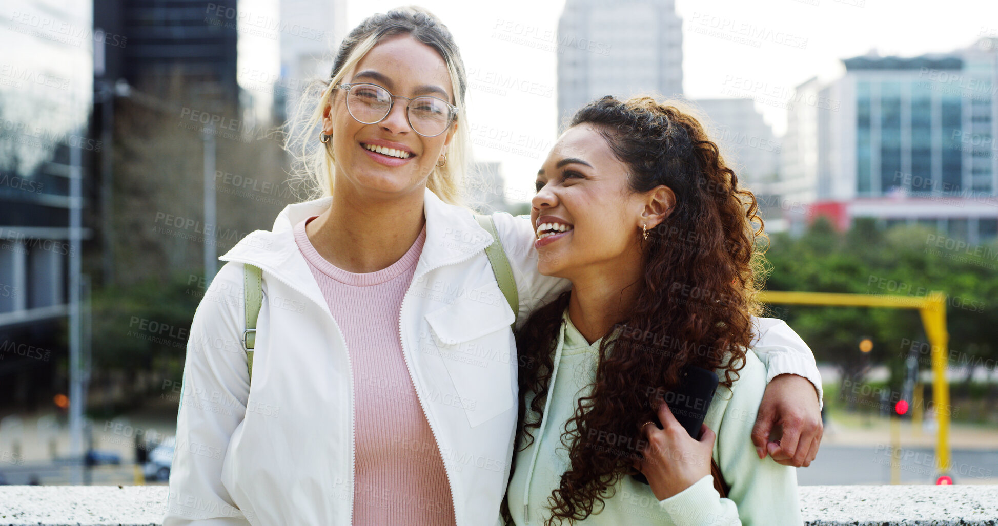 Buy stock photo College students, friends and happy women hug in city for education, scholarship and laugh. Portrait, university campus and girls embrace outdoor together with gen z for support, funny and bonding