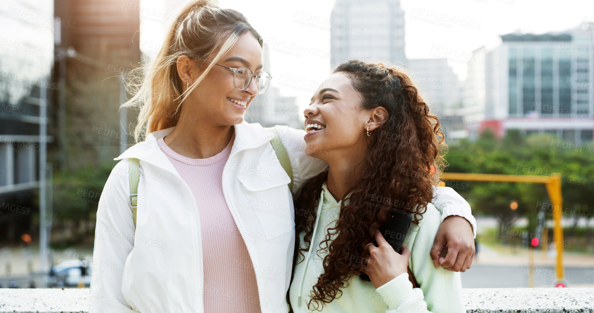 Buy stock photo Students, friends and women in city hug outdoor for education, learning and commute to college. Happy, university and people embrace in town for studying, future career and opportunity on campus