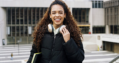 Buy stock photo Student, portrait of girl and smile on campus with headphones for music, knowledge and academics. Female person, audio tech and happy outdoor at university for education or future career opportunity