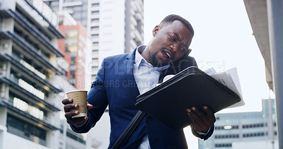 Buy stock photo Businessman, phone call and stress in city with chaos, documents and overworked for late appointment. Coffee, commute and black person on smartphone for walk, networking and schedule multitasking