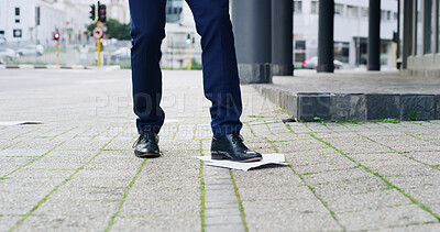Buy stock photo Legs, business and person with shoes in city for travel, pickup documents and litter accident. Man, feet and standing on paper to reduce waste, clumsy employee and trash flyer for career opportunity