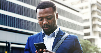 Buy stock photo Black man, reading and notification with phone in city for business schedule or social media. Businessman, employee or user with mobile smartphone for research, network service or connection in town