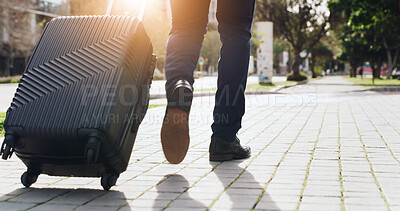 Buy stock photo Legs, luggage and steps with businessman in city for commute, journey or travel from back. Flare, suitcase and walking with feet of employee outdoor on sidewalk for trip to international destination