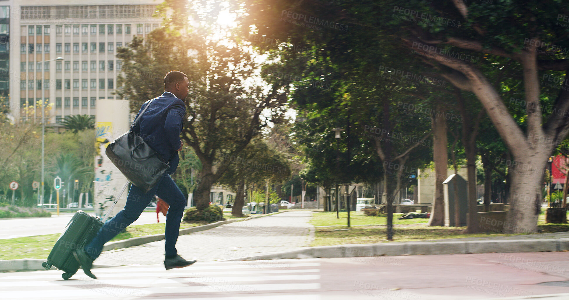 Buy stock photo Business, city and black man running late with luggage for travel, urban commute and journey. African worker, suitcase and rush outdoor with speed, hurry or delay with flight for work trip with flare