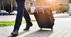 Legs, suitcase and walking with businessman in city for commute, journey or travel to location. Flare, luggage and steps with feet of employee on sidewalk for trip to international destination
