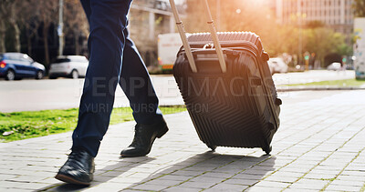 Buy stock photo Legs, suitcase and walking with businessman in city for commute, journey or travel to location. Flare, luggage and steps with feet of employee on sidewalk for trip to international destination