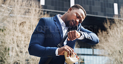 Buy stock photo Phone call, check time and businessman in city for schedule, appointment and travel with food. Watch, mobile and African worker outdoor for commute, late and communication with meal on the go