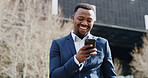 City, phone and smile of business black man reading text message for real estate feedback or update. App, communication and good news with happy employee outdoor for commercial property development