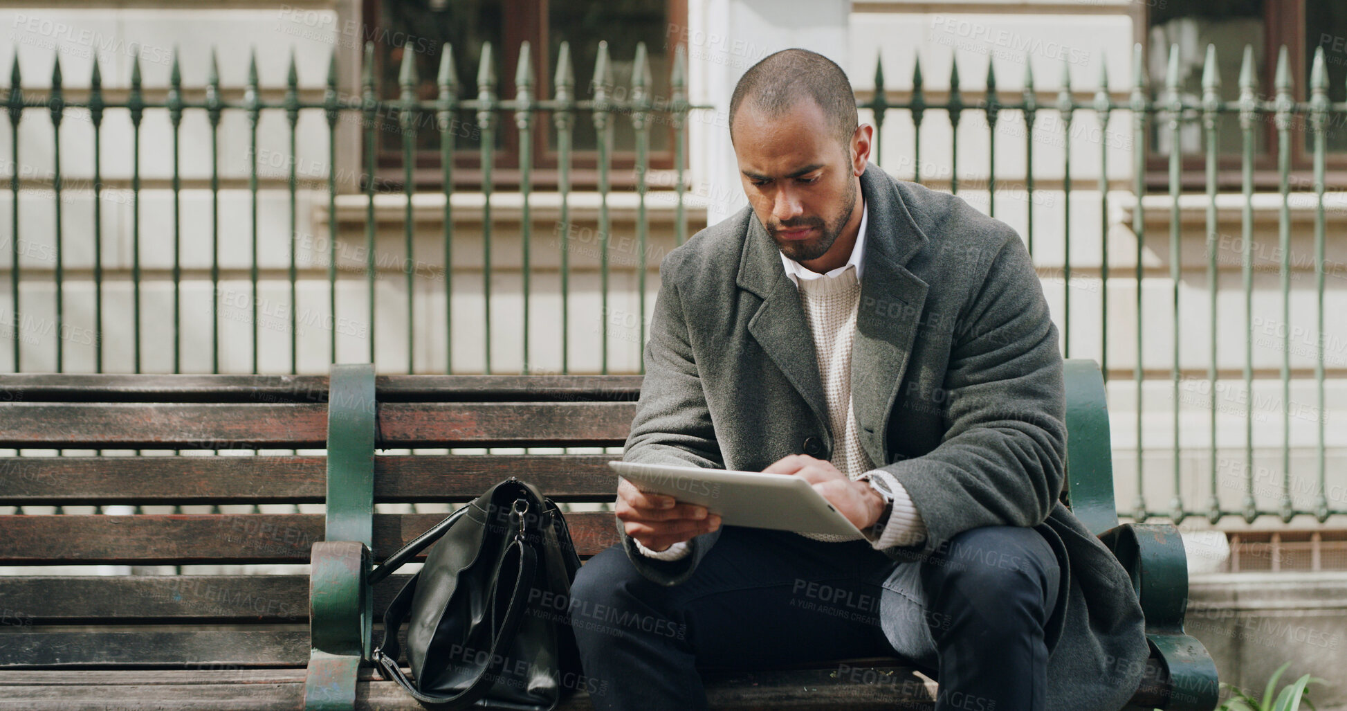 Buy stock photo Tablet, city and business man on bench for reading email, research or housing development. Tech, outdoor and serious urban planner with app for online project or review proposal for infrastructure