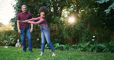 Buy stock photo Grandfather, child and playing golf outdoor for hobby, learning skills and teaching technique. Family, senior man and girl kid with sports in garden for bonding together, swing practice and weekend