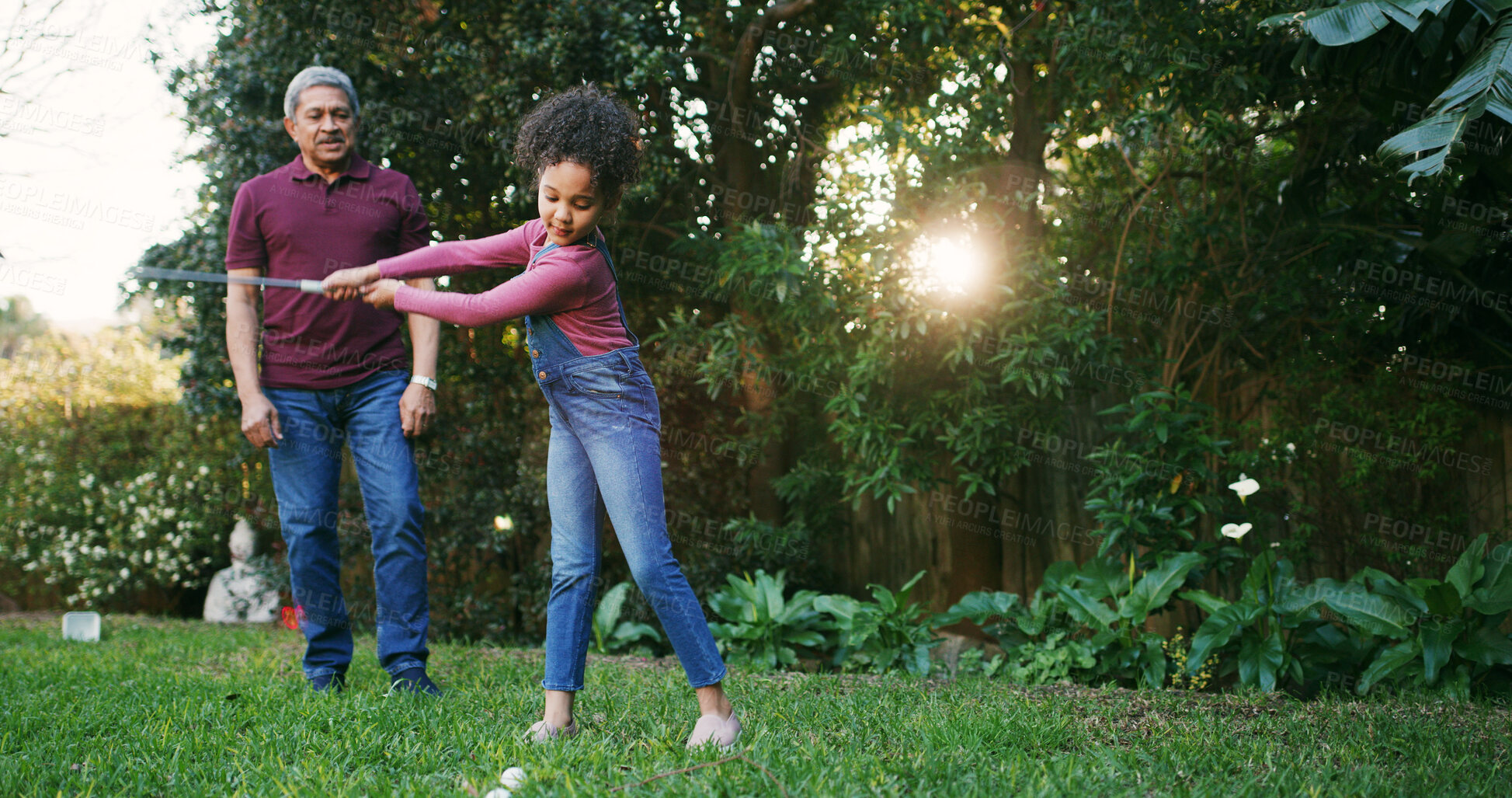 Buy stock photo Grandfather, child and playing golf outdoor for hobby, learning skills and teaching technique. Family, senior man and girl kid with sports in garden for bonding together, swing practice and weekend