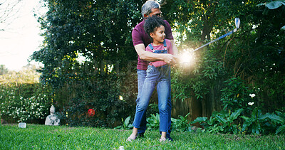 Buy stock photo Golf, teaching and grandfather with kid in nature for swing, target practice and support together. Sports prodigy, learning and game mentor with old man and girl in backyard of home for put and hobby