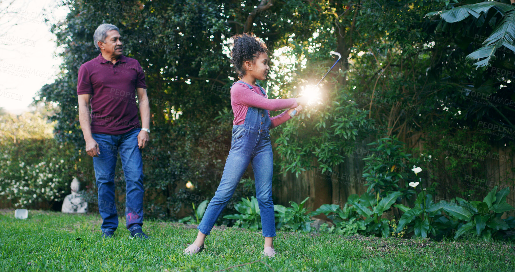 Buy stock photo Grandpa, child and playing golf outdoor for weekend activity, learning skills and teaching technique. Family, senior man and girl with sports in garden for bonding together, swing practice or support