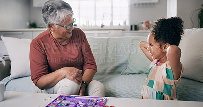 Buy stock photo Activity, fun or necklace with girl and grandmother in living room of home for bonding or crafts. Creative, diy or jewellery making with grandchild and senior woman in apartment for relationship