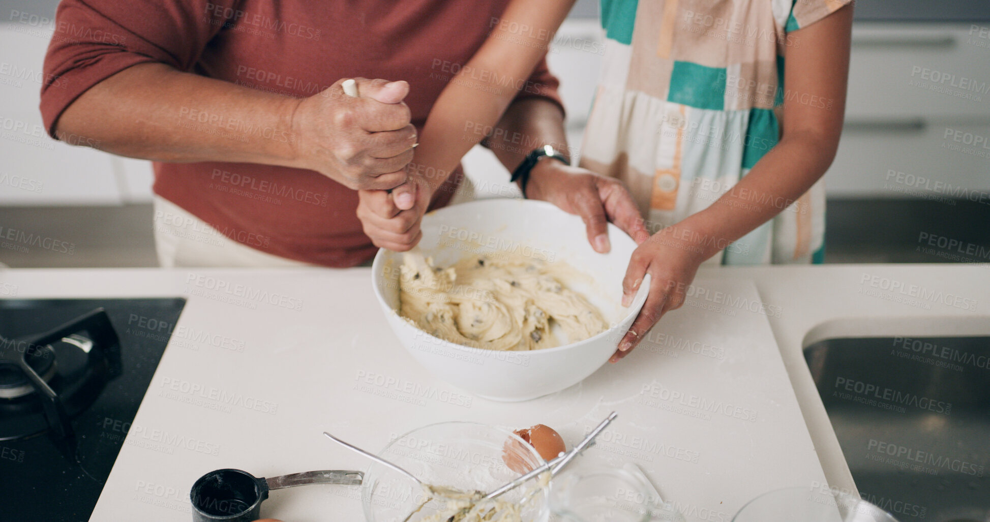 Buy stock photo Baking, hands and parent with child, kitchen or mixing ingredients for dessert or skill development. Teaching, kid and person with bowl for pastry, helping and learning recipe for meal prep in house