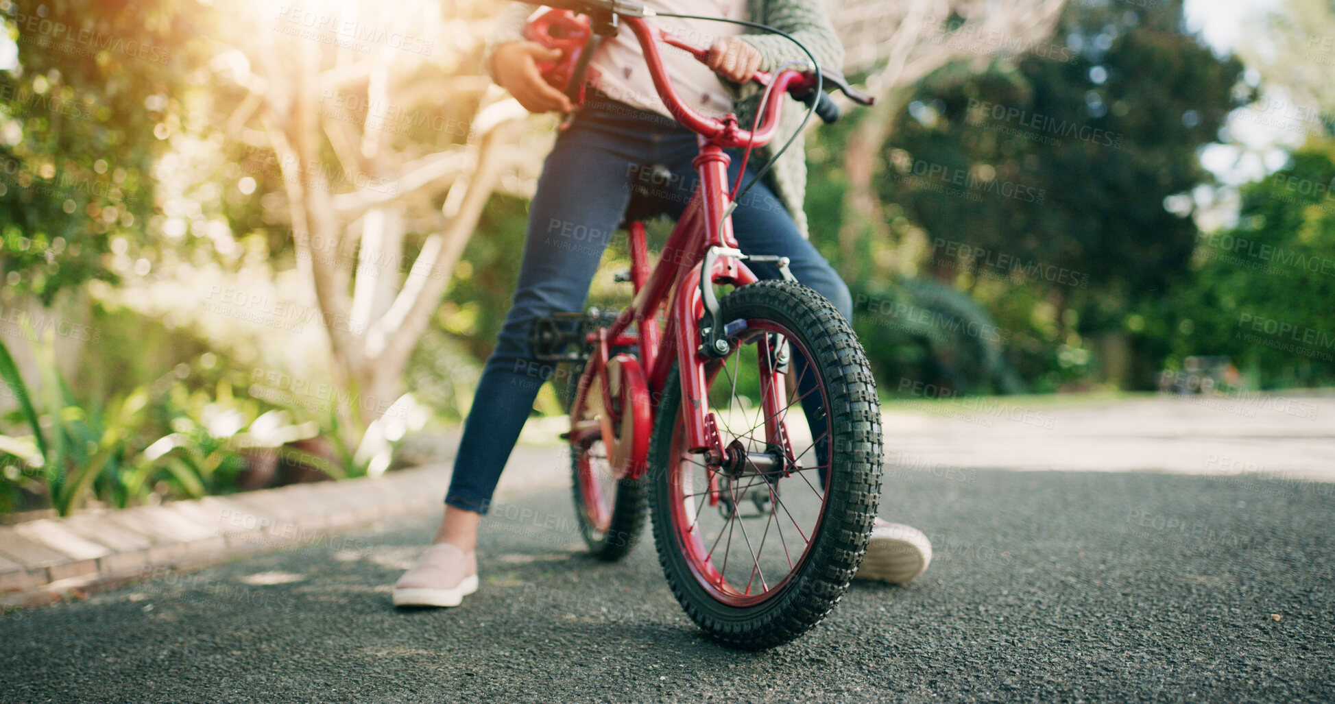 Buy stock photo Legs, bicycle and child at park, outdoor and helmet for protection, learning and ride in nature. Kid, bike and cycling with safety gear, wheels or ppe for fun with adventure on road in summer