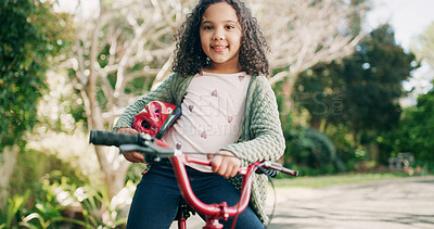 Buy stock photo Girl, child and portrait with bicycle at park, smile or outdoor with helmet, pride or confident in summer. Kid, bike and happy with safety gear for ride, fun and adventure with transport in Brazil