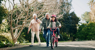 Buy stock photo Grandparents, child and learning with bike for picture or memory of family bonding outdoor. Grandmother, grandfather and girl ride bicycle, teaching cycling and phone for photo with happy generations