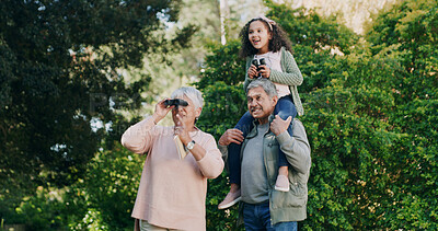Buy stock photo Bird watching, grandparents and girl with family, forest and  bonding together with hobby. Grandchild, old man and senior woman in woods, binocular and countryside with view, sightseeing and travel