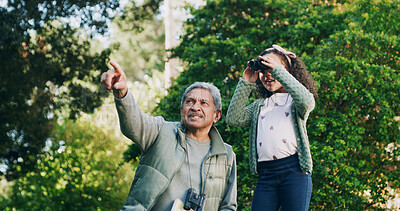 Buy stock photo Grandfather, child and binocular in park for travel, sightseeing and pointing with view for bonding. Man, girl and explore for adventure, bird watching or fun together in nature with family in Mexico
