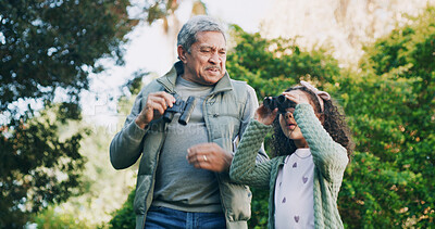 Buy stock photo Grandfather, girl and binocular in park for travel, sightseeing or search with view for bonding. Old man, child and explore for adventure, bird watching or together in nature with family in Mexico