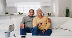 Hug, portrait and watching tv with old couple on sofa in living room of home for bonding or streaming. Love, retirement and smile with senior people in apartment together for television entertainment