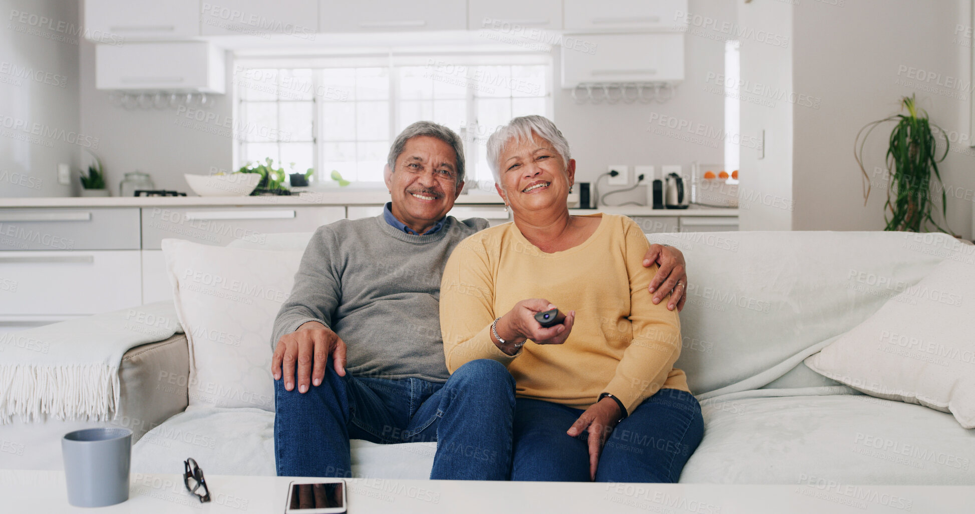 Buy stock photo Hug, portrait and watching tv with old couple on sofa in living room of home for bonding or streaming. Love, retirement and smile with senior people in apartment together for television entertainment