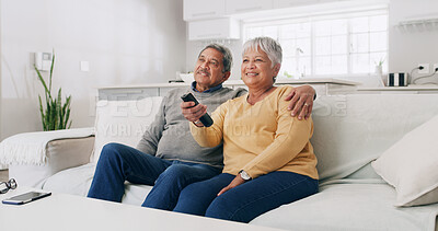 Buy stock photo Hug, love and watching TV with old couple on sofa in living room of home for bonding or streaming. Relax, retirement and smile with senior people in apartment together for television entertainment