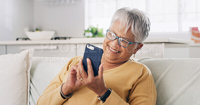 Buy stock photo Senior woman, phone and happy on sofa for text message, reading ebook and search online news. Retirement, old person and relax with smartphone in home for social media update and download mobile app