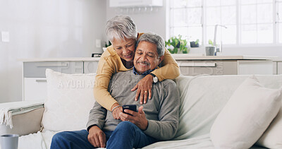 Buy stock photo Home, smartphone and senior couple with smile, internet and bonding together with funny meme. Pensioner, apartment or old man with mature woman, cellphone or love with social media or online chatting