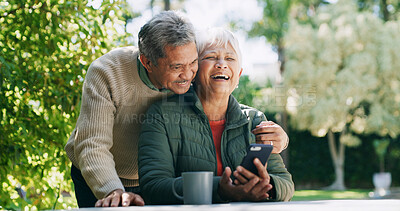 Buy stock photo Backyard, laughing and senior couple with phone for funny conversation, bonding and relax outdoor Retirement home, garden and mature man and woman on smartphone for internet, connection and website