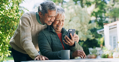 Buy stock photo Backyard, happy and senior couple with phone for funny conversation, bonding and relax outdoor Retirement home, garden and mature man and woman laugh on smartphone for internet, connection or website
