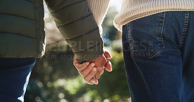 Buy stock photo Love, senior couple and holding hands at park for anniversary date, retirement support and bonding. Closeup, elderly people and affection in nature for marriage commitment and relationship security