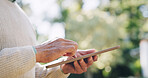 Man, hands and tablet with research outdoor for retirement information, email or reading online news. Senior person, digital tech and scrolling at park for social media update and download mobile app