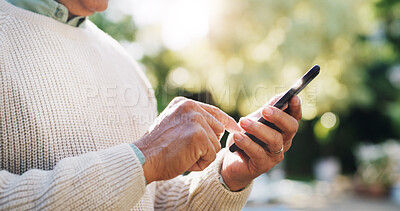 Buy stock photo Senior man, hands and phone outdoor for typing message, retirement research or reading online news. Elderly person, smartphone and scrolling in nature for social media update and download mobile app