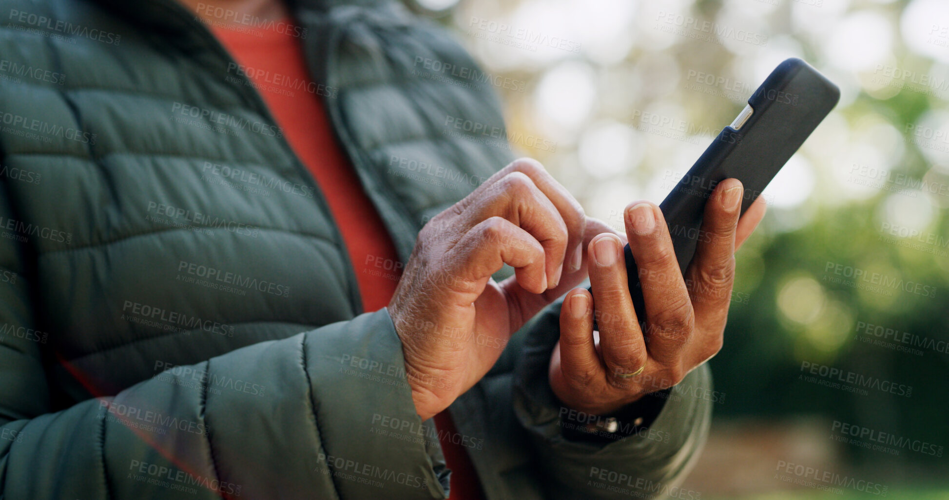 Buy stock photo Hands, outdoor and senior woman with smartphone, connection and social media with internet. Closeup, forest and mature person with cellphone, texting and message to contact, communication and app