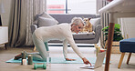 Yoga, mature woman and laptop in home for online tutorial, health class and morning fitness routine. Wellness, workout and person on floor with tech for virtual pilates, exercise video and self care