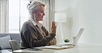 Laptop, video call and wave with woman in home office for online communication or remote work. Computer, greeting and virtual meeting with mature freelance employee in apartment for discussion